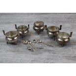Japanese silver cruet set of cauldron form comprising two open salt cellars, two open pepper pots