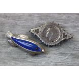 Lapis lazuli and garnet silver brooch modelled as a fish, the body formed of lapis lazuli