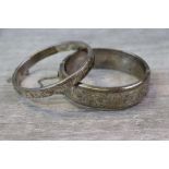 Elizabeth Silver hinged bangle, engraved scroll decoration to upper half, width approximately 7.5mm,