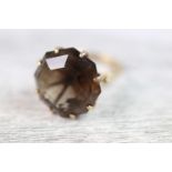 Smokey quartz 9ct yellow gold ring, the large octagonal mixed cut citrine measuring approximately