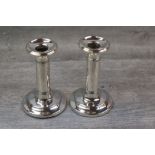 Pair of Edwardian silver candlesticks of circular column form, band detail, moulded foot, makers I S