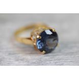 Synthetic colour change sapphire yellow gold ring, the round mixed cut synthetic colour change