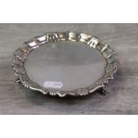 George II silver card tray/ salver raised on three hoof feet, pie crust border with scallop and
