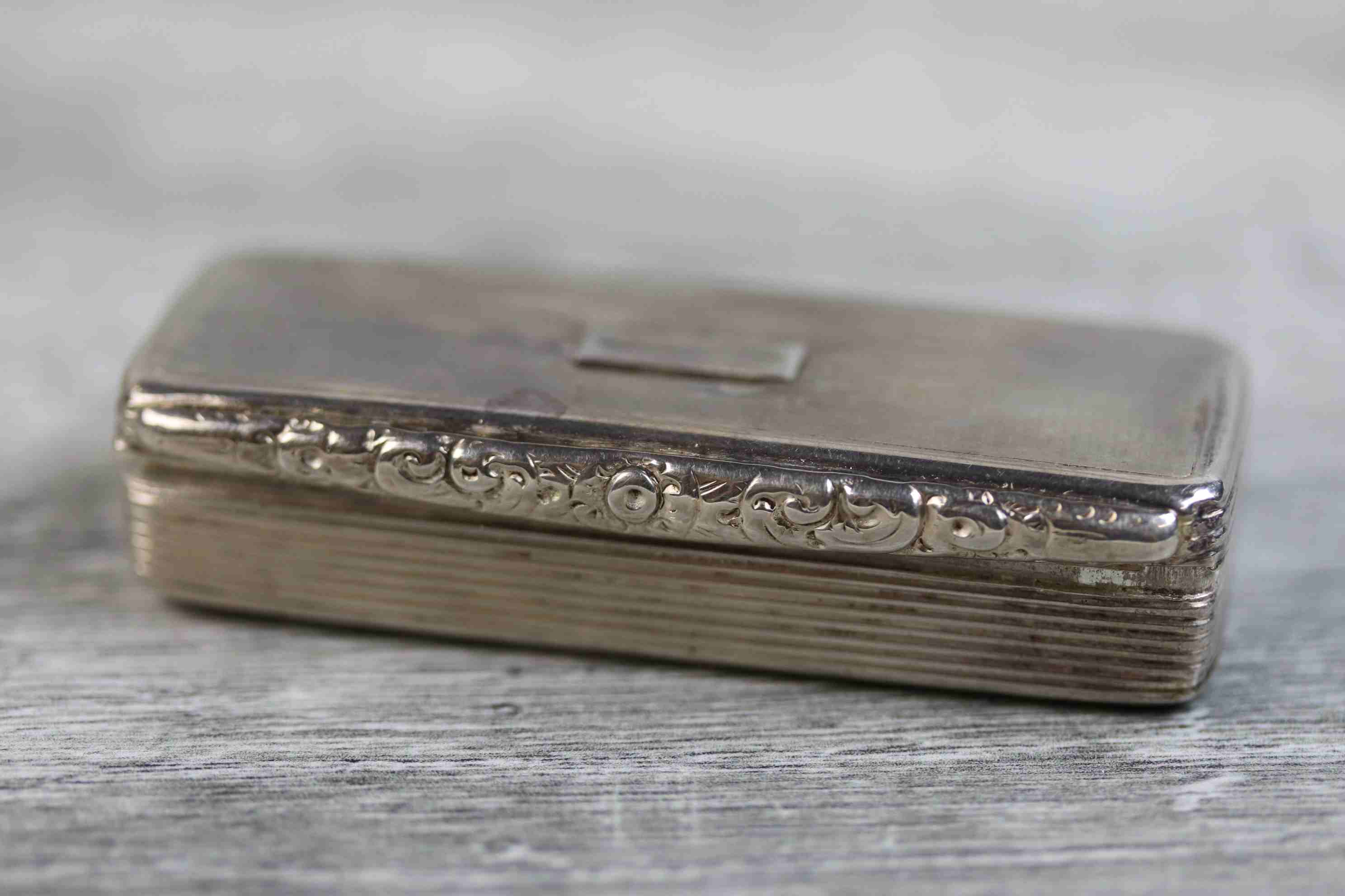 George IV silver snuff box of elongated rectangular form, blank cartouche to hinged lid, rubbed - Image 3 of 7