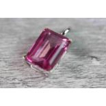 Pink topaz and white sapphire 9ct white gold pendant, the large rectangular step cut pink topaz