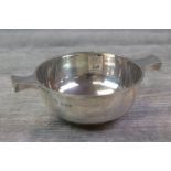 Late Victorian silver quaich of plain simple form, waisted handles, raised on shallow foot, makers
