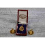 Three enamelled 9ct yellow gold medals: a 9ct yellow gold medal awarded by Tynemouth Village to J.W.