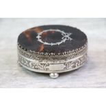 Edwardian tortoiseshell silver trinket box of oval form raised on four bun feet, the tortoiseshell