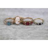 Four gemstone and paste set 9ct yellow gold dress rings, to include sapphire and diamond 9ct