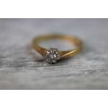 Diamond solitaire 18ct yellow gold ring, the round brilliant cut diamond weighing approximately 0.20
