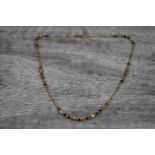 Indian 22ct yellow gold necklace with faceted black beads and textured gold bead spacers, figaro