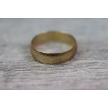 9ct yellow gold wedding band, width approximately 6mm, ring size V