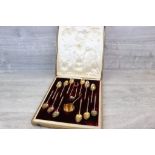 Late 19th century cased set of twelve French parcel-gilt silver teaspoons, sugar tongs and tea