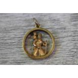 Yellow metal St Christopher pendant, diameter approximately 2cm, tests as 9ct gold