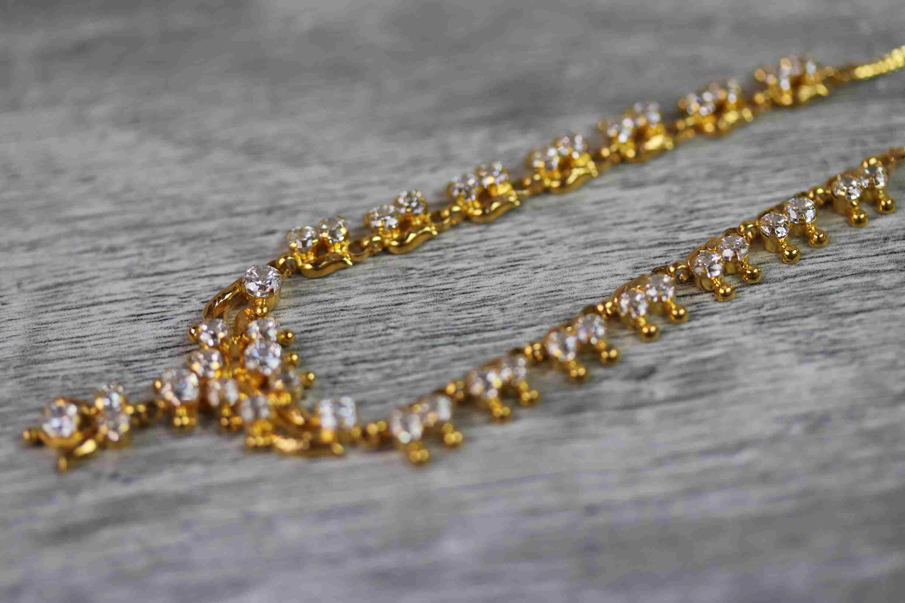 Indian yellow metal CZ fringe necklace, the central motif with suspended CZ cluster pendant drop, - Image 6 of 9