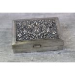 Continental silver rectangular trinket box with hinged lid, repousse flower bud and foliate scroll