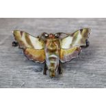 Enamelled diamond white metal bar brooch modelled as a moth; yellow, brown, green and cream