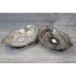Pair of pierced silver bread baskets, marquise shaped, four repousse lion head masks to each corner,