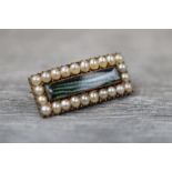 Late Victorian/ Edwardian seed pearl rose metal rectangular brooch, the rectangular central glazed