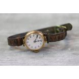 Vintage Ladies 9ct Gold wristwatch with enamel dial, vintage leather strap and a 15 jewel Swiss