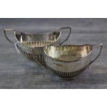 Late Victorian silver twin handled sugar bowl of boat shape form, gadrooning to lower half,