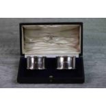 Pair of George V Mappin & Webb silver napkin rings of plain form with pie crust border, hallmarked