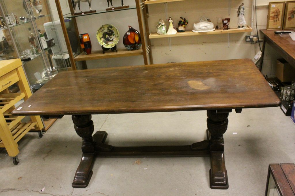 20th century Oak Refectory Style Dining Table raised on Large Carved Cup and Cover Supports with a