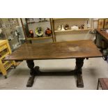 20th century Oak Refectory Style Dining Table raised on Large Carved Cup and Cover Supports with a