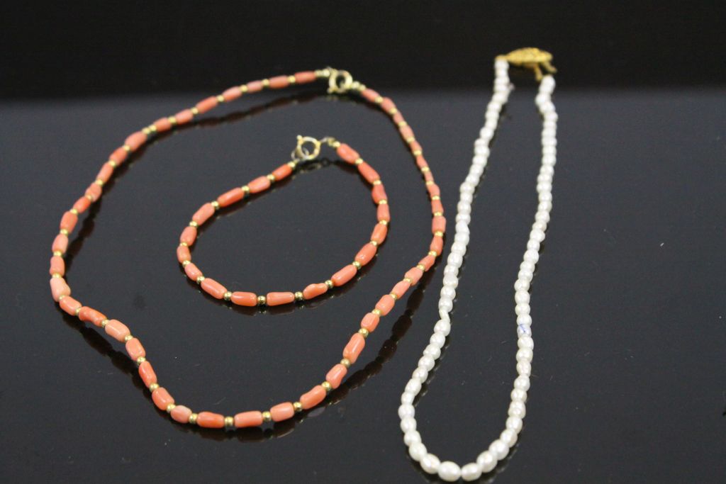 Coral Necklace and matching Bracelet together with a Freshwater Necklace