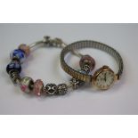 Pandora marked Charm bracelet with Three Pandora Charms & two glass beads and three Murano Glass