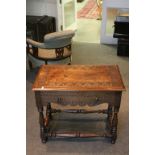 Oak Gothic Style Side Table with carving to top and sides, shaped apron and raised on turned