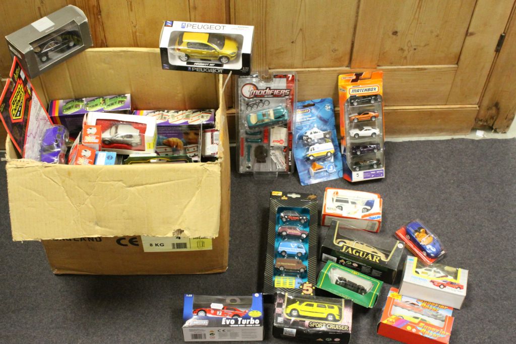 Collection of Boxed Diecast Vehicles including Matchbox and Maisto