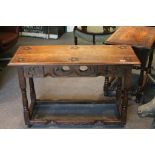Oak Gothic Style Side Table, the top and apron carved with flowers raised on square and baluster