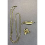 Rolled Gold leaf brooch, yellow metal leaf brooch and a Gold plated necklace