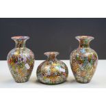 Pair of Murano Millefiori Glass Vases, 18cms high together with a similar Squat Vase, 12cms high