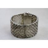 Hallmarked Silver Peruvian panel Bracelet with pierced decration and set with small pieces of