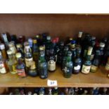 A Shelf containing a large amount of collectable miniature alcohol bottle, various drinks 1950's-