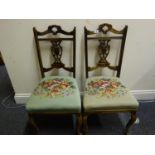 Pair of 19c Art Nouveau style mahogany open chairs each with a needle point classical style