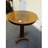 Small circular topped centre table, Victorian period on a platform base,