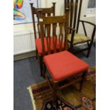 Pair of oak Art Nouveau chairs with inlaid decoration to the back, burgundy upholstered