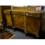 Good quality walnut inverted serpentine shaped sideboard with 4 ball and claw feet to the front, the