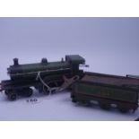 Bassett Lowke one probably made by Bing tin plate O-gauge wind up train and tender, green decoration