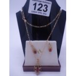 9ct gold pendant necklace and pair of earrings set with garnets, total weight including stones 4