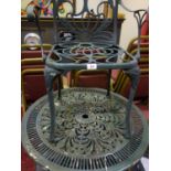 Exterior circular green metal garden table and 2 carver chairs, in a used condition