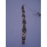 Ladies 9ct gold link bracelet, 7.5" long with safety clasp marked 375, 14 grams set with white clear