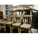 Vintage pine and elm children's nursery chairs, 7 in total, each one with a spoke back, matching set
