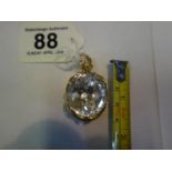 Oval Rock Crystal pendant set in 750 18ct gold, crystal stone measures approx 40ct, total weight