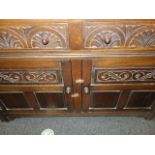 Arched topped solid oak dresser 6'6 tall x 4' wide, the base section containing a collection of