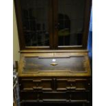 1920's Jacobean inspired Bureau Bookcase with barley twist raised support, containing a Bureau