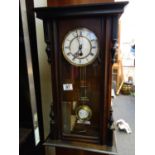 Regulator wall clock in a mahogany case, 8 day movement in working order,